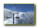 Ski trip students enjoy a lift ride